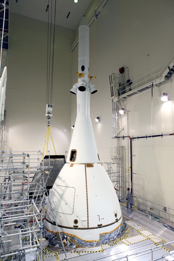 Inside the Launch Abort System Facility at NASA’s Kennedy Space Center in Florida, a crane brings the fourth and final Ogive panel closer for installation on Orion's Launch Abort System. The panels will smooth the airflow over the conical spacecraft to limit sound and vibration. Image Credit: NASA/Kim Shiflett Inside the Launch Abort System Facility at NASA’s Kennedy Space Center in Florida, a crane brings the fourth and final Ogive panel closer for installation on Orion's Launch Abort System. The panels will smooth the airflow over the conical spacecraft to limit sound and vibration. Image Credit: NASA/Kim Shiflett