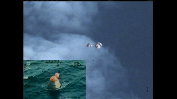 Following a perfect launch and more than four hours in Earth's orbit, NASA's Orion spacecraft is seen from an unpiloted aircraft descending under three massive red and white main parachutes and then shortly after its bullseye splashdown in the Pacific Ocean, 600 miles southwest of San Diego. During the uncrewed test, Orion traveled twice through the Van Allen belt, where it experienced periods of intense radiation, and reached an altitude of 3,600 miles above Earth. The spacecraft hit speeds of 20,000 mph and weathered temperatures approaching 4,000 degrees Fahrenheit as it entered Earth’s atmosphere. Image Credit: NASA Following a perfect launch and more than four hours in Earth's orbit, NASA's Orion spacecraft is seen from an unpiloted aircraft descending under three massive red and white main parachutes and then shortly after its bullseye splashdown in the Pacific Ocean, 600 miles southwest of San Diego. During the uncrewed test, Orion traveled twice through the Van Allen belt, where it experienced periods of intense radiation, and reached an altitude of 3,600 miles above Earth. The spacecraft hit speeds of 20,000 mph and weathered temperatures approaching 4,000 degrees Fahrenheit as it entered Earth’s atmosphere. Image Credit: NASA