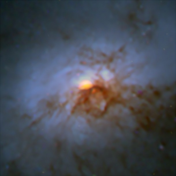 A combined Hubble Space Telescope / ALMA image of NGC 1266. The ALMA data (orange) are shown in the central region. Credit: NASA/ESA Hubble; ALMA (NRAO/ESO/NAOJ) A combined Hubble Space Telescope / ALMA image of NGC 1266. The ALMA data (orange) are shown in the central region. Credit: NASA/ESA Hubble; ALMA (NRAO/ESO/NAOJ)