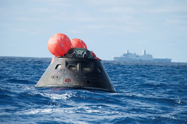 NASA's Orion spacecraft awaits the U.S. Navy's USS Anchorage for a ride home. Orion launched into space on a two-orbit, 4.5-test flight at 7:05 am EST on Dec. 5, and returned safely splashed down in the Pacific Ocean. Image Credit: U.S. Navy NASA's Orion spacecraft awaits the U.S. Navy's USS Anchorage for a ride home. Orion launched into space on a two-orbit, 4.5-test flight at 7:05 am EST on Dec. 5, and returned safely splashed down in the Pacific Ocean. Image Credit: U.S. Navy