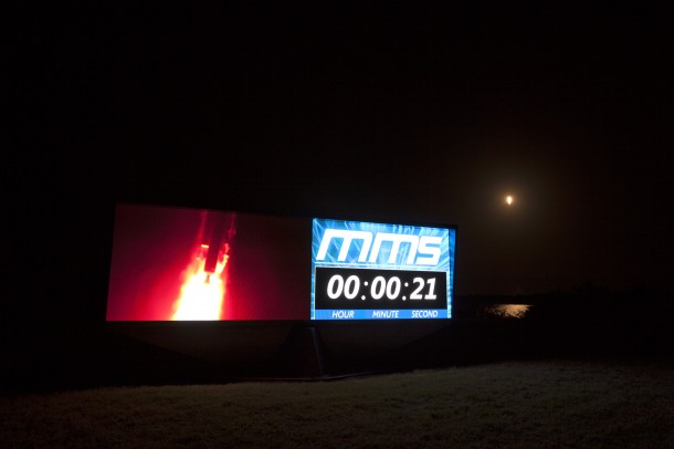 As an Atlas V rocket lifts off from Space Launch Complex 41 at Cape Canaveral Air Force Station in the background, the launch can also be seen on the countdown clock at the Kennedy Space Center's Press Site. The rocket is carrying NASA's Magnetospheric Multiscale, or MMS, spacecraft. Image Credit: NASA/Frankie Martin As an Atlas V rocket lifts off from Space Launch Complex 41 at Cape Canaveral Air Force Station in the background, the launch can also be seen on the countdown clock at the Kennedy Space Center's Press Site. The rocket is carrying NASA's Magnetospheric Multiscale, or MMS, spacecraft. Image Credit: NASA/Frankie Martin