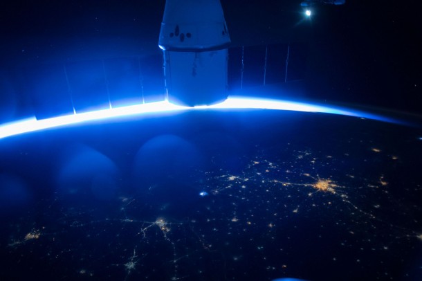 SpaceX’s Dragon cargo capsule is seen here docked to the Earth facing port of the Harmony module. SpaceX’s sixth commercial resupply flight to the International Space Station launched on April 14th and arrived three days later. It will depart with over 3,100 pounds of research samples and equipment and splashdown in the Pacific Ocean on May 21. SpaceX’s Dragon cargo capsule is seen here docked to the Earth facing port of the Harmony module. SpaceX’s sixth commercial resupply flight to the International Space Station launched on April 14th and arrived three days later. It will depart with over 3,100 pounds of research samples and equipment and splashdown in the Pacific Ocean on May 21.