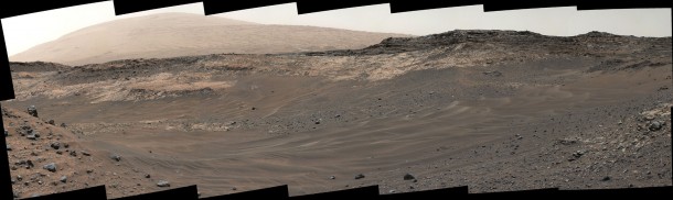 This May 10, 2015, view from Curiosity's Mastcam shows terrain judged difficult for traversing between the rover and an outcrop in the middle distance where a pale rock unit meets a darker rock unit above it. The rover team decided not to approach this outcrop and identified an alternative. Credit: NASA/JPL-Caltech/MSSS This May 10, 2015, view from Curiosity's Mastcam shows terrain judged difficult for traversing between the rover and an outcrop in the middle distance where a pale rock unit meets a darker rock unit above it. The rover team decided not to approach this outcrop and identified an alternative. Credit: NASA/JPL-Caltech/MSSS