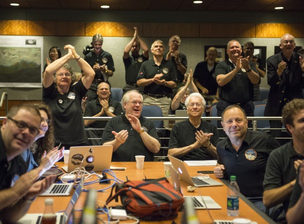 Members of the New Horizons science team react to seeing the spacecraft's last and sharpest image of Pluto before closest approach later in the day, Tuesday, July 14, 2015 at the Johns Hopkins University Applied Physics Laboratory in Laurel, Maryland. Credits: NASA/Bill Ingalls Members of the New Horizons science team react to seeing the spacecraft's last and sharpest image of Pluto before closest approach later in the day, Tuesday, July 14, 2015 at the Johns Hopkins University Applied Physics Laboratory in Laurel, Maryland. Credits: NASA/Bill Ingalls