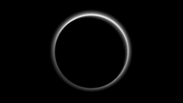 Backlit by the sun, Pluto’s atmosphere rings its silhouette like a luminous halo in this image taken by NASA’s New Horizons spacecraft around midnight EDT on July 15. This global portrait of the atmosphere was captured when the spacecraft was about 1.25 million miles (2 million kilometers) from Pluto and shows structures as small as 12 miles across. The image, delivered to Earth on July 23, is displayed with north at the top of the frame. Credits: NASA/JHUAPL/SwRI Backlit by the sun, Pluto’s atmosphere rings its silhouette like a luminous halo in this image taken by NASA’s New Horizons spacecraft around midnight EDT on July 15. This global portrait of the atmosphere was captured when the spacecraft was about 1.25 million miles (2 million kilometers) from Pluto and shows structures as small as 12 miles across. The image, delivered to Earth on July 23, is displayed with north at the top of the frame. Credits: NASA/JHUAPL/SwRI