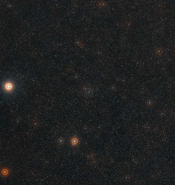 This wide-field view of the sky around the cluster IC 4651 was created from photographic material forming part of the Digitized Sky Survey 2. The cluster itself is the clump of faint stars in the central part of the picture. The bright star at the left is Alpha Arae, one of the brightest stars in the constellation of Ara (The Altar). Credit: ESO/Digitized Sky Survey 2. Acknowledgement: Davide De Martin This wide-field view of the sky around the cluster IC 4651 was created from photographic material forming part of the Digitized Sky Survey 2. The cluster itself is the clump of faint stars in the central part of the picture. The bright star at the left is Alpha Arae, one of the brightest stars in the constellation of Ara (The Altar). Credit: ESO/Digitized Sky Survey 2. Acknowledgement: Davide De Martin