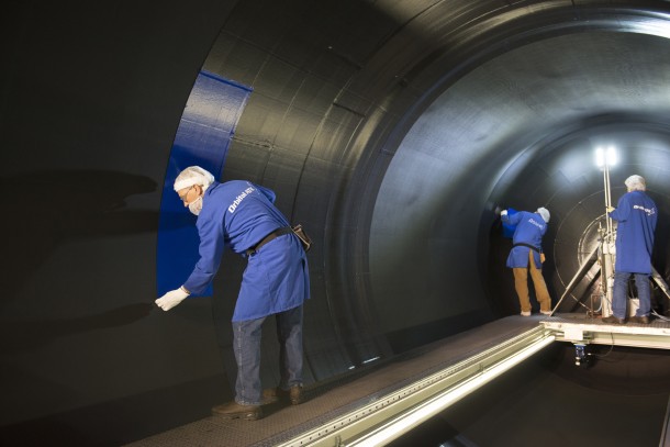 An Orbital ATK employee installs insulation to the rear segment for the second booster qualification test. Credits: Orbital ATK An Orbital ATK employee installs insulation to the rear segment for the second booster qualification test. Credits: Orbital ATK