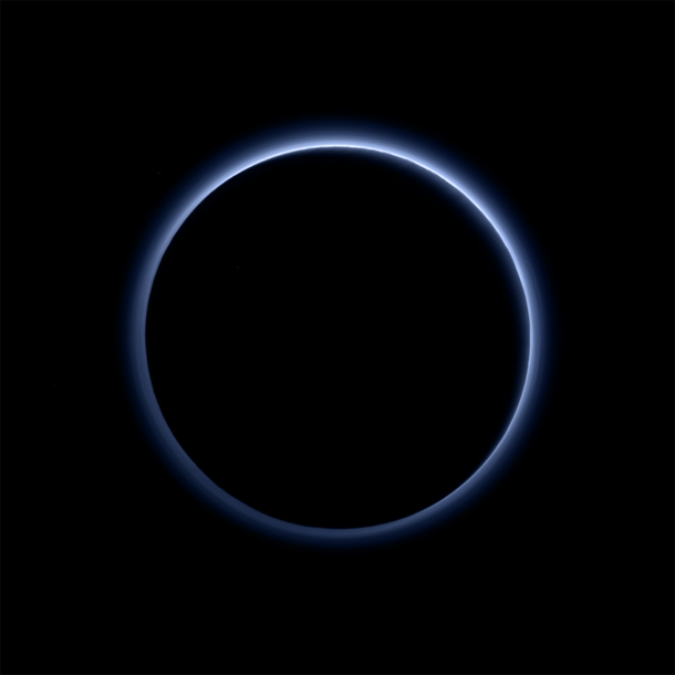 Pluto’s Blue Sky: Pluto’s haze layer shows its blue color in this picture taken by the New Horizons Ralph/Multispectral Visible Imaging Camera (MVIC). The high-altitude haze is thought to be similar in nature to that seen at Saturn’s moon Titan. The source of both hazes likely involves sunlight-initiated chemical reactions of nitrogen and methane, leading to relatively small, soot-like particles (called tholins) that grow as they settle toward the surface. This image was generated by software that combines information from blue, red and near-infrared images to replicate the color a human eye would perceive as closely as possible. Credits: NASA/JHUAPL/SwRI Pluto’s Blue Sky: Pluto’s haze layer shows its blue color in this picture taken by the New Horizons Ralph/Multispectral Visible Imaging Camera (MVIC). The high-altitude haze is thought to be similar in nature to that seen at Saturn’s moon Titan. The source of both hazes likely involves sunlight-initiated chemical reactions of nitrogen and methane, leading to relatively small, soot-like particles (called tholins) that grow as they settle toward the surface. This image was generated by software that combines information from blue, red and near-infrared images to replicate the color a human eye would perceive as closely as possible. Credits: NASA/JHUAPL/SwRI