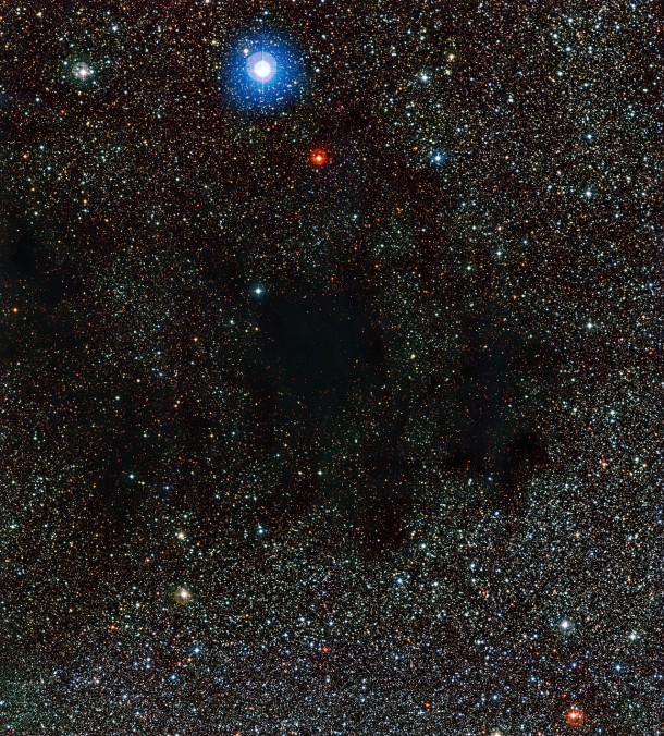 This image from the Wide Field Imager on the MPG/ESO 2.2-metre telescope shows part of the huge cloud of dust and gas known as the Coalsack Nebula. The dust in this nebula absorbs and scatters the light from background stars. Credit: ESO This image from the Wide Field Imager on the MPG/ESO 2.2-metre telescope shows part of the huge cloud of dust and gas known as the Coalsack Nebula. The dust in this nebula absorbs and scatters the light from background stars. Credit: ESO