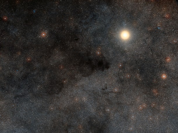 This rich landscape is part of the small constellation of Crux (The Southern Cross). The very bright star is Alpha Crucis, also know as Acrux, one of the four stars that make up the famous cross shape. Most of the upper left part of this image is filled with dark dusty clouds that form part of the huge dark nebula called the Coalsack. Credit: ESO/Digitized Sky Survey 2. Acknowledgment: Davide De Martin This rich landscape is part of the small constellation of Crux (The Southern Cross). The very bright star is Alpha Crucis, also know as Acrux, one of the four stars that make up the famous cross shape. Most of the upper left part of this image is filled with dark dusty clouds that form part of the huge dark nebula called the Coalsack. Credit: ESO/Digitized Sky Survey 2. Acknowledgment: Davide De Martin