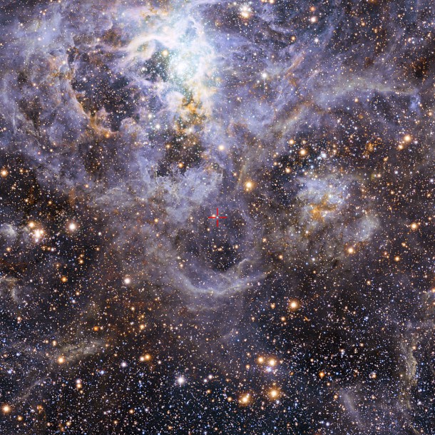 This view of the Tarantula star-forming region includes visible-light images from the Wide Field Imager at the MPG/ESO 2.2-metre telescope at La Silla and infrared images from the 4.1-metre infrared VISTA telescope at Paranal. Credit: ESO/M.-R. Cioni/VISTA Magellanic Cloud survey. Acknowledgment: Cambridge Astronomical Survey Unit This view of the Tarantula star-forming region includes visible-light images from the Wide Field Imager at the MPG/ESO 2.2-metre telescope at La Silla and infrared images from the 4.1-metre infrared VISTA telescope at Paranal. Credit: ESO/M.-R. Cioni/VISTA Magellanic Cloud survey. Acknowledgment: Cambridge Astronomical Survey Unit