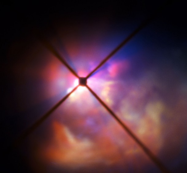 In this very close-up view from SPHERE the star itself is hidden behind an obscuring disc. The crosses are artefacts due to features in the instrument. Credit: ESO In this very close-up view from SPHERE the star itself is hidden behind an obscuring disc. The crosses are artefacts due to features in the instrument. Credit: ESO