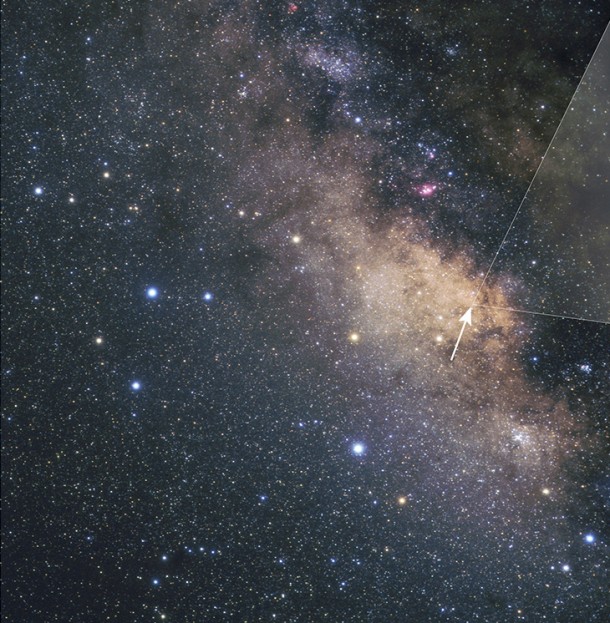 Ground-based view of the Milky Way’s central bulge, seen in the direction of the constellation Sagittarius. Giant dust clouds block most of the starlight coming from the galactic center. Hubble however, peered through a region (marked by the arrow) called the Sagittarius Window, which offers a keyhole view into the galaxy’s hub. Credits: A. Fujii Ground-based view of the Milky Way’s central bulge, seen in the direction of the constellation Sagittarius. Giant dust clouds block most of the starlight coming from the galactic center. Hubble however, peered through a region (marked by the arrow) called the Sagittarius Window, which offers a keyhole view into the galaxy’s hub. Credits: A. Fujii