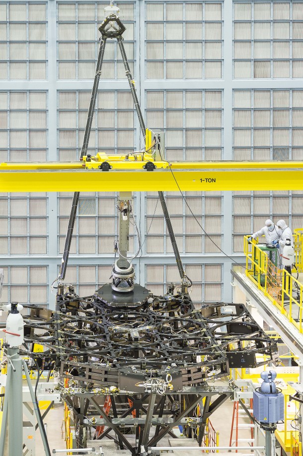 The James Webb Space Telescope team successfully installed the first flight mirror onto the telescope structure at NASA's Goddard Space Flight Center in Greenbelt, Maryland. Credits: NASA/Chris Gunn The James Webb Space Telescope team successfully installed the first flight mirror onto the telescope structure at NASA's Goddard Space Flight Center in Greenbelt, Maryland. Credits: NASA/Chris Gunn