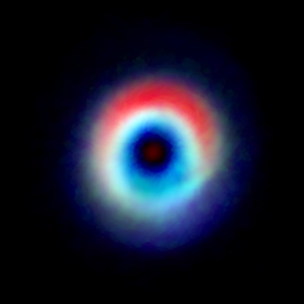 A composite image of the HD 142527 binary star system from data captured by the Atacama Large Millimeter/submillimeter Array shows a distinctive arc of dust (red) and a ring of carbon monoxide (blue and green). The red arc is free of gas, suggesting the carbon monoxide has "frozen out," forming a layer of frost on the dust grains in that region. Astronomers speculate this frost provides a boost to planet formation. Credit: Andrea Isella/Rice University; B. Saxton (NRAO/AUI/NSF); ALMA (NRAO/ESO/NAOJ) A composite image of the HD 142527 binary star system from data captured by the Atacama Large Millimeter/submillimeter Array shows a distinctive arc of dust (red) and a ring of carbon monoxide (blue and green). The red arc is free of gas, suggesting the carbon monoxide has "frozen out," forming a layer of frost on the dust grains in that region. Astronomers speculate this frost provides a boost to planet formation. Credit: Andrea Isella/Rice University; B. Saxton (NRAO/AUI/NSF); ALMA (NRAO/ESO/NAOJ)