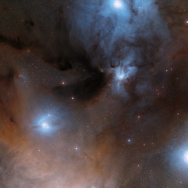 This wide-field view shows a spectacular region of dark and bright clouds, forming part of a region of star formation in the constellation of Ophiuchus (The Serpent Bearer). This picture was created from images in the Digitized Sky Survey 2. Credit: ESO/Digitized Sky Survey 2 Acknowledgement: Davide De Martin This wide-field view shows a spectacular region of dark and bright clouds, forming part of a region of star formation in the constellation of Ophiuchus (The Serpent Bearer). This picture was created from images in the Digitized Sky Survey 2. Credit: ESO/Digitized Sky Survey 2 Acknowledgement: Davide De Martin