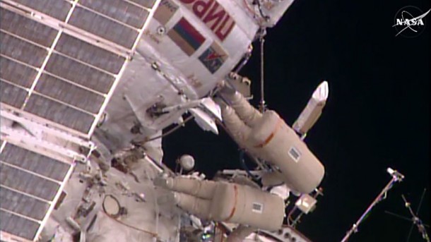 Spacewalkers Yuri Malenchenko and Sergey Volkov work outside the Pirs docking compartment on gear installation and science experiments. Credit: NASA TV Spacewalkers Yuri Malenchenko and Sergey Volkov work outside the Pirs docking compartment on gear installation and science experiments. Credit: NASA TV