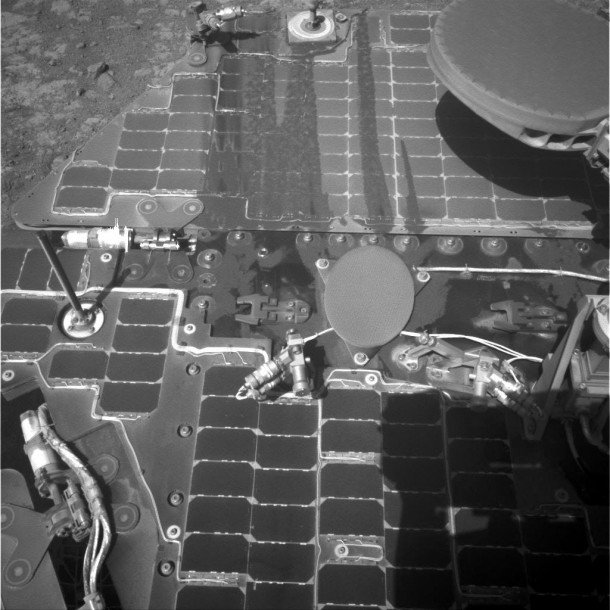 This March 21, 2016, image from the navigation camera on NASA's Mars rover Opportunity shows streaks of dust or sand on the vehicle's rear solar panel after a series of drives during which the rover was pointed steeply uphill. The tilt and jostling of the drives affected material on the rover deck. This March 21, 2016, image from the navigation camera on NASA's Mars rover Opportunity shows streaks of dust or sand on the vehicle's rear solar panel after a series of drives during which the rover was pointed steeply uphill. The tilt and jostling of the drives affected material on the rover deck.