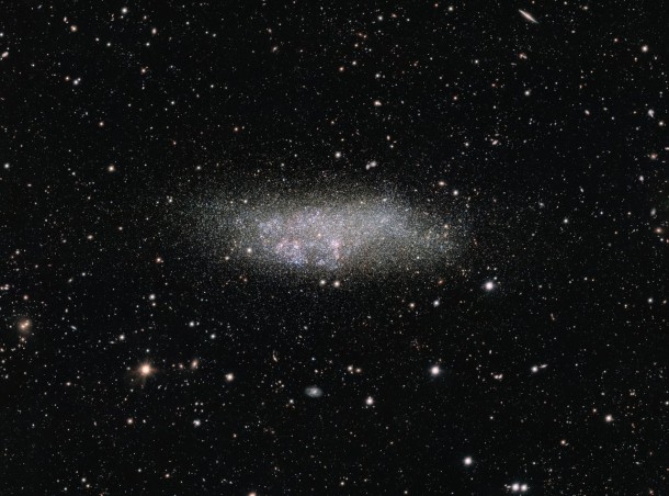 This image, captured by ESO’s OmegaCAM on the VLT Survey Telescope, shows a lonely galaxy known as Wolf-Lundmark-Melotte, or WLM for short. Although considered part of our Local Group of dozens of galaxies, WLM stands alone at the group’s outer edges as one of its most remote members. In fact, the galaxy is so small and secluded that it may never have interacted with any other Local Group galaxy — or perhaps even any other galaxy in the history of the Universe. Credit: ESO Acknowledgement: VST/Omegacam Local Group Survey This image, captured by ESO’s OmegaCAM on the VLT Survey Telescope, shows a lonely galaxy known as Wolf-Lundmark-Melotte, or WLM for short. Although considered part of our Local Group of dozens of galaxies, WLM stands alone at the group’s outer edges as one of its most remote members. In fact, the galaxy is so small and secluded that it may never have interacted with any other Local Group galaxy — or perhaps even any other galaxy in the history of the Universe. Credit: ESO Acknowledgement: VST/Omegacam Local Group Survey