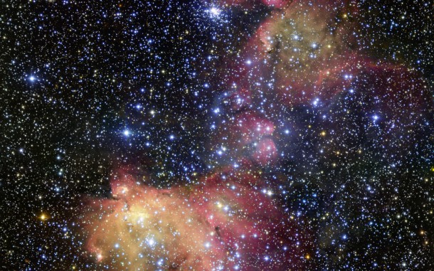 In this image from ESO’s Very Large Telescope (VLT), light from blazing blue stars energises the gas left over from the stars’ recent formation. The result is a strikingly colourful emission nebula, called LHA 120-N55, in which the stars are adorned with a mantle of glowing gas. Astronomers study these beautiful displays to learn about the conditions in places where new stars develop. Credit: ESO In this image from ESO’s Very Large Telescope (VLT), light from blazing blue stars energises the gas left over from the stars’ recent formation. The result is a strikingly colourful emission nebula, called LHA 120-N55, in which the stars are adorned with a mantle of glowing gas. Astronomers study these beautiful displays to learn about the conditions in places where new stars develop. Credit: ESO