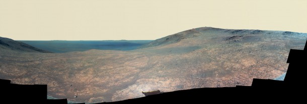 "Marathon Valley" on Mars opens to a view across Endeavour Crater in this enhanced-color version of a scene from the Pancam of NASA's Mars Exploration Rover Opportunity. The scene merges many exposures taken during April and May 2016. The foreground shows the fractured texture of the valley. Image Credit: NASA/JPL-Caltech/Cornell Univ./Arizona State Univ. "Marathon Valley" on Mars opens to a view across Endeavour Crater in this enhanced-color version of a scene from the Pancam of NASA's Mars Exploration Rover Opportunity. The scene merges many exposures taken during April and May 2016. The foreground shows the fractured texture of the valley. Image Credit: NASA/JPL-Caltech/Cornell Univ./Arizona State Univ.