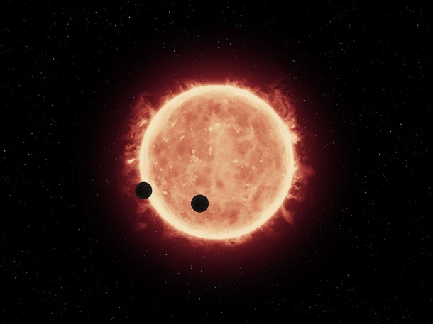 This artist's illustration shows two Earth-sized planets, TRAPPIST-1b and TRAPPIST-1c, passing in front of their parent red dwarf star, which is much smaller and cooler than our sun. NASA's Hubble Space Telescope looked for signs of atmospheres around these planets. Credits: NASA/ESA/STScI/J. de Wit (MIT) This artist's illustration shows two Earth-sized planets, TRAPPIST-1b and TRAPPIST-1c, passing in front of their parent red dwarf star, which is much smaller and cooler than our sun. NASA's Hubble Space Telescope looked for signs of atmospheres around these planets. Credits: NASA/ESA/STScI/J. de Wit (MIT)