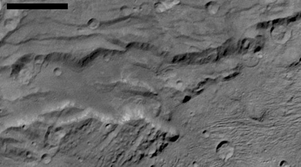 Scientists from NASA's New Horizons mission have spotted signs of long run-out landslides on Pluto's largest moon, Charon. On this image of Charon's informally named "Serenity Chasma," from New Horizons' Long Range Reconnaissance Imager (LORRI), arrows mark indications of landslide activity. Image Credit: NASA/Johns Hopkins University Applied Physics Laboratory/Southwest Research Center Scientists from NASA's New Horizons mission have spotted signs of long run-out landslides on Pluto's largest moon, Charon. On this image of Charon's informally named "Serenity Chasma," from New Horizons' Long Range Reconnaissance Imager (LORRI), arrows mark indications of landslide activity. Image Credit: NASA/Johns Hopkins University Applied Physics Laboratory/Southwest Research Center