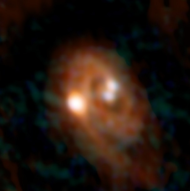 Combined ALMA and VLA image of L1448 IRS3B system. Credit: Bill Saxton, ALMA (ESO/NAOJ/NRAO), NRAO/AUI/NSF. Combined ALMA and VLA image of L1448 IRS3B system. Credit: Bill Saxton, ALMA (ESO/NAOJ/NRAO), NRAO/AUI/NSF.
