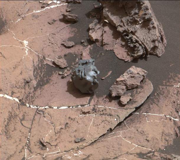 The dark, smooth-surfaced rock at the center of this Oct. 30, 2016, image from the Mast Camera (Mastcam) on NASA's Curiosity Mars rover was examined with laser pulses and confirmed to be an iron-nickel meteorite. It is about the size of a golf ball. Credit: NASA/JPL-Caltech/MSSS The dark, smooth-surfaced rock at the center of this Oct. 30, 2016, image from the Mast Camera (Mastcam) on NASA's Curiosity Mars rover was examined with laser pulses and confirmed to be an iron-nickel meteorite. It is about the size of a golf ball. Credit: NASA/JPL-Caltech/MSSS