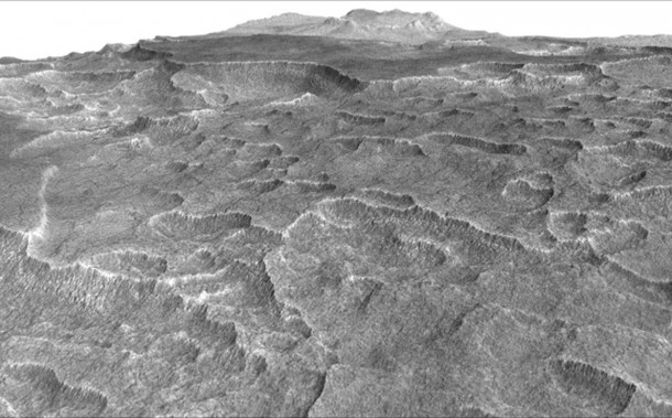 This vertically exaggerated view shows scalloped depressions in a part of Mars where such textures prompted researchers to check for buried ice, using ground-penetrating radar aboard NASA's Mars Reconnaissance Orbiter. Image Credit: NASA/JPL-Caltech/Univ. of Arizona This vertically exaggerated view shows scalloped depressions in a part of Mars where such textures prompted researchers to check for buried ice, using ground-penetrating radar aboard NASA's Mars Reconnaissance Orbiter. Image Credit: NASA/JPL-Caltech/Univ. of Arizona
