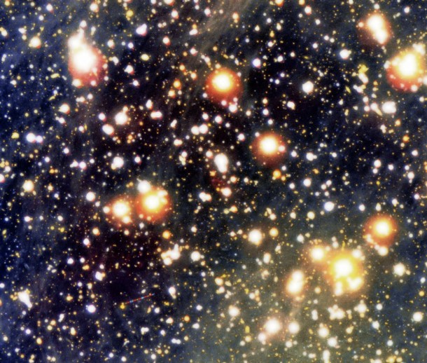 Colour composite photo of the sky field around the lonely neutron star RX J1856.5-3754 and the related cone-shaped nebula. It is based on a series of exposures obtained with the multi-mode FORS2 instrument at VLT KUEYEN through three different optical filters. The trail of an asteroid is seen in the field with intermittent blue, green and red colours. RX J1856.5-3754 is exactly in the centre of the image. Credit: ESO Colour composite photo of the sky field around the lonely neutron star RX J1856.5-3754 and the related cone-shaped nebula. It is based on a series of exposures obtained with the multi-mode FORS2 instrument at VLT KUEYEN through three different optical filters. The trail of an asteroid is seen in the field with intermittent blue, green and red colours. RX J1856.5-3754 is exactly in the centre of the image. Credit: ESO