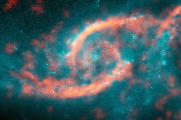 Dazzling eyelid-like features bursting with stars in galaxy IC 2163 formed from a tsunami of stars and gas triggered by a glancing collision with galaxy NGC 2207 (a portion of its spiral arm is shown on right side of image). ALMA image of carbon monoxide (orange), which revealed motion of the gas in these features, is shown on top of Hubble image (blue) of the galaxy. Credit: M. Kaufman; B. Saxton (NRAO/AUI/NSF); ALMA (ESO/NAOJ/NRAO); NASA/ESA Hubble Space Telescope Dazzling eyelid-like features bursting with stars in galaxy IC 2163 formed from a tsunami of stars and gas triggered by a glancing collision with galaxy NGC 2207 (a portion of its spiral arm is shown on right side of image). ALMA image of carbon monoxide (orange), which revealed motion of the gas in these features, is shown on top of Hubble image (blue) of the galaxy. Credit: M. Kaufman; B. Saxton (NRAO/AUI/NSF); ALMA (ESO/NAOJ/NRAO); NASA/ESA Hubble Space Telescope