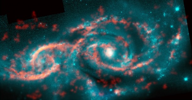 Galaxies IC 2163 (left) and NGC 2207 (right) recently grazed past each other, triggering a tsunami of stars and gas in IC 2163 and producing the dazzling eyelid-like features there. ALMA image of carbon monoxide (orange), which revealed motion of the gas in these features, is shown on top of Hubble image (blue) of the galaxy pair. Credit: M. Kaufman; B. Saxton (NRAO/AUI/NSF); ALMA (ESO/NAOJ/NRAO); NASA/ESA Hubble Space Telescope Galaxies IC 2163 (left) and NGC 2207 (right) recently grazed past each other, triggering a tsunami of stars and gas in IC 2163 and producing the dazzling eyelid-like features there. ALMA image of carbon monoxide (orange), which revealed motion of the gas in these features, is shown on top of Hubble image (blue) of the galaxy pair. Credit: M. Kaufman; B. Saxton (NRAO/AUI/NSF); ALMA (ESO/NAOJ/NRAO); NASA/ESA Hubble Space Telescope