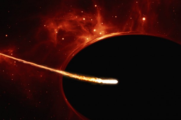 This artist’s impression depicts a Sun-like star close to a rapidly spinning supermassive black hole, with a mass of about 100 million times the mass of the Sun, in the centre of a distant galaxy. Its large mass bends the light from stars and gas behind it. Despite being way more massive than the star, the supermassive black hole has an event horizon which is only 200 times larger than the size of the star. Its fast rotation has changed its shape into an oblate sphere. The gravitational pull of the supermassive black hole rips the the star apart in a tidal disruption event. In the process, the star was “spaghettified” and shocks in the colliding debris as well as heat generated in accretion led to a burst of light. Credit: ESO, ESA/Hubble, M. Kornmesser This artist’s impression depicts a Sun-like star close to a rapidly spinning supermassive black hole, with a mass of about 100 million times the mass of the Sun, in the centre of a distant galaxy. Its large mass bends the light from stars and gas behind it. Despite being way more massive than the star, the supermassive black hole has an event horizon which is only 200 times larger than the size of the star. Its fast rotation has changed its shape into an oblate sphere. The gravitational pull of the supermassive black hole rips the the star apart in a tidal disruption event. In the process, the star was “spaghettified” and shocks in the colliding debris as well as heat generated in accretion led to a burst of light. Credit: ESO, ESA/Hubble, M. Kornmesser
