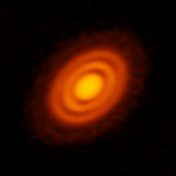 ALMA image of the protoplanetary disk surrounding the young star HD 163296 as seen in dust. New observations suggested that two planets, each about the size of Saturn, are in orbit around the star. These planets, which are not yet fully formed, revealed themselves by the dual imprint they left in both the dust and the gas portions of the star’s protoplanetary disk. Credit: ALMA (ESO/NAOJ/NRAO); A. Isella; B. Saxton (NRAO/AUI/NSF) ALMA image of the protoplanetary disk surrounding the young star HD 163296 as seen in dust. New observations suggested that two planets, each about the size of Saturn, are in orbit around the star. These planets, which are not yet fully formed, revealed themselves by the dual imprint they left in both the dust and the gas portions of the star’s protoplanetary disk. Credit: ALMA (ESO/NAOJ/NRAO); A. Isella; B. Saxton (NRAO/AUI/NSF)
