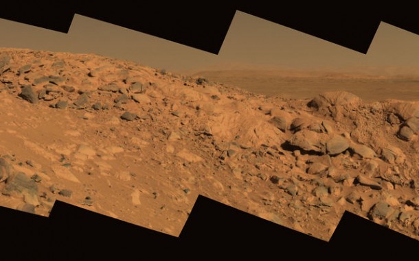 This approximate true-color image taken by the Mars Exploration Rover Spirit shows a rock outcrop dubbed 'Longhorn,' and behind it, the sweeping plains of Gusev Crater. This approximate true-color image taken by the Mars Exploration Rover Spirit shows a rock outcrop dubbed 'Longhorn,' and behind it, the sweeping plains of Gusev Crater.