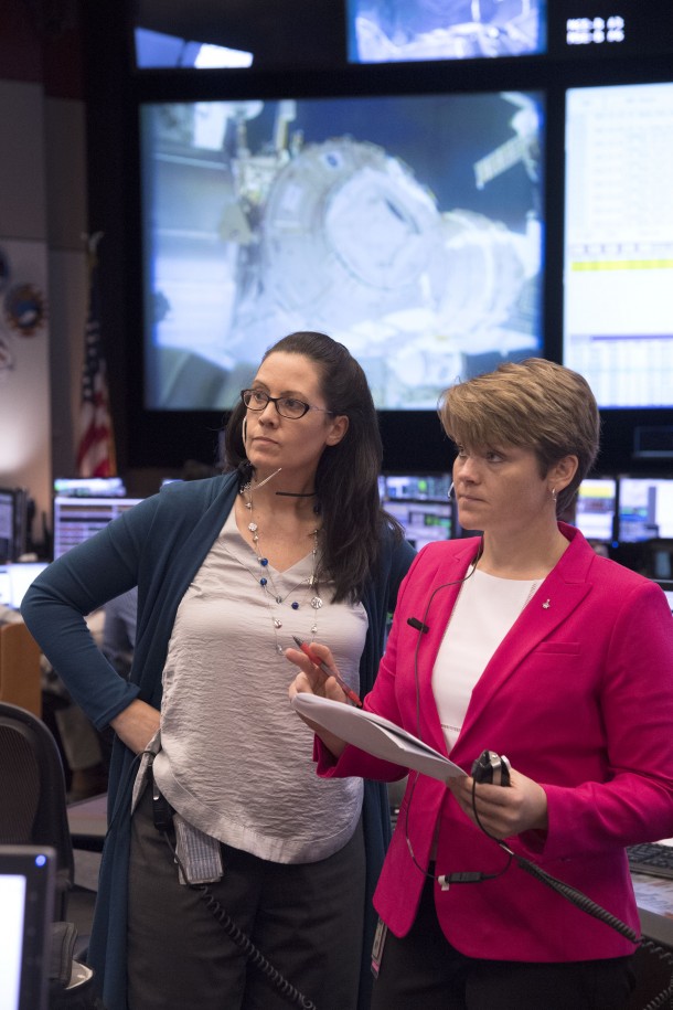 Flight Director Emily Nelson and Capcom Anne McClain in Houston work to come up with a plan to replace a lost thermal and micrometeoroid shield during a spacewalk. Credits: NASA/James Blair Flight Director Emily Nelson and Capcom Anne McClain in Houston work to come up with a plan to replace a lost thermal and micrometeoroid shield during a spacewalk. Credits: NASA/James Blair