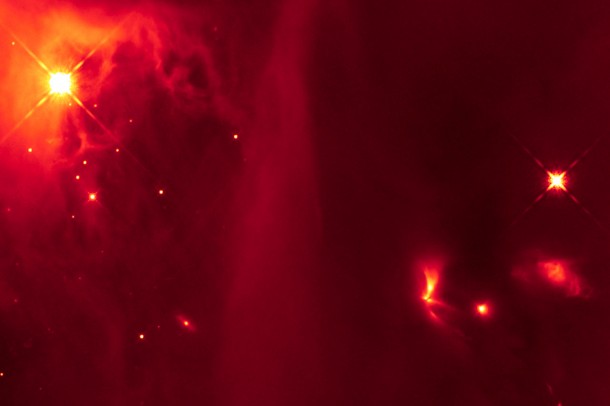 This infrared image from the Hubble Space Telescope contains a bright, fan-shaped object (lower right quadrant) thought to be a binary star that emits light pulses as the two stars interact. The primitive binary system is located in the IC 348 region of the Perseus molecular cloud and was included in the study by the Berkeley/Harvard team. NASA, ESA and J. Muzerolle, STScI This infrared image from the Hubble Space Telescope contains a bright, fan-shaped object (lower right quadrant) thought to be a binary star that emits light pulses as the two stars interact. The primitive binary system is located in the IC 348 region of the Perseus molecular cloud and was included in the study by the Berkeley/Harvard team. NASA, ESA and J. Muzerolle, STScI
