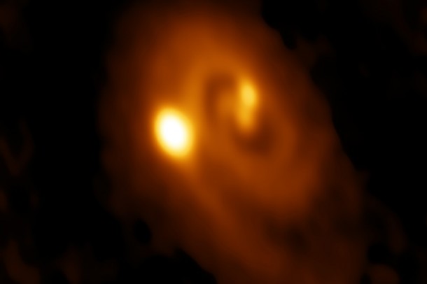 A radio image of a triple star system forming within a dusty disk in the Perseus molecular cloud obtained by the Atacama Large Millimeter/submillimeter Array (ALMA) in Chile. Bill Saxton, ALMA (ESO/NAOJ/NRAO), NRAO/AUI/NSF A radio image of a triple star system forming within a dusty disk in the Perseus molecular cloud obtained by the Atacama Large Millimeter/submillimeter Array (ALMA) in Chile. Bill Saxton, ALMA (ESO/NAOJ/NRAO), NRAO/AUI/NSF