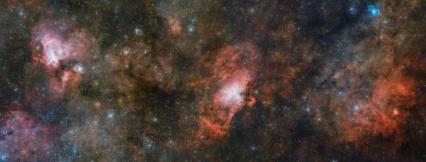 Two of the sky’s more famous residents share the stage with a lesser-known neighbour in this enormous three gigapixel image from ESO’s VLT Survey Telescope (VST). On the right lies the faint, glowing cloud of gas called Sharpless 2-54, the iconic Eagle Nebula (Messier 16) is in the centre, and the Omega Nebula (Messier 17) to the left. This cosmic trio makes up just a portion of a vast complex of gas and dust within which new stars are springing to life and illuminating their surroundings. Credit: ESO Two of the sky’s more famous residents share the stage with a lesser-known neighbour in this enormous three gigapixel image from ESO’s VLT Survey Telescope (VST). On the right lies the faint, glowing cloud of gas called Sharpless 2-54, the iconic Eagle Nebula (Messier 16) is in the centre, and the Omega Nebula (Messier 17) to the left. This cosmic trio makes up just a portion of a vast complex of gas and dust within which new stars are springing to life and illuminating their surroundings. Credit: ESO