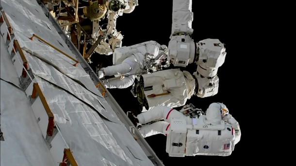 Spacewalkers Mark Vande Hei and Randy Bresnik work on installing a new latching end effector on the tip of the Canadarm2 robotic arm. Credit: NASA TV Spacewalkers Mark Vande Hei and Randy Bresnik work on installing a new latching end effector on the tip of the Canadarm2 robotic arm. Credit: NASA TV