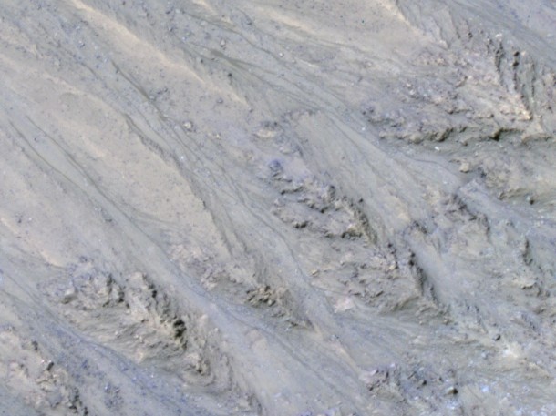 This inner slope of a Martian crater has several of the seasonal dark streaks called "recurrent slope lineae," or RSL, that a November 2017 report interprets as granular flows, rather than darkening due to flowing water. The image is from the HiRISE camera on NASA's Mars Reconnaissance Orbiter. Credits: NASA/JPL-Caltech/UA/USGS This inner slope of a Martian crater has several of the seasonal dark streaks called "recurrent slope lineae," or RSL, that a November 2017 report interprets as granular flows, rather than darkening due to flowing water. The image is from the HiRISE camera on NASA's Mars Reconnaissance Orbiter. Credits: NASA/JPL-Caltech/UA/USGS