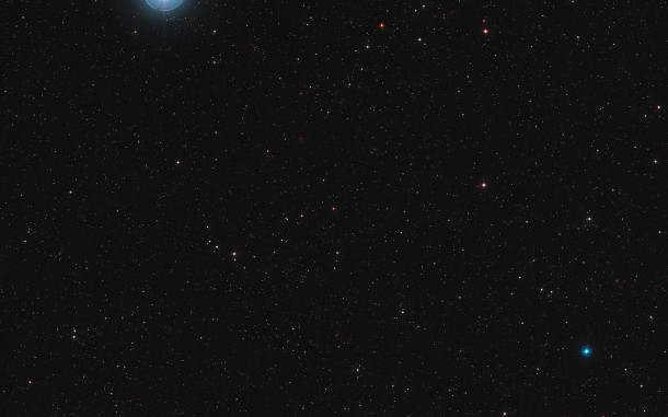 This image shows the sky around the red dwarf star Ross 128 in the constellation of Virgo (The Virgin). It was created from images forming part of the Digitized Sky Survey 2. Ross 128 appears at the centre of the picture. Close inspection reveals that Ross 128 has a strange multiple appearance as this image was created from photographs taken over a more than forty year period, and the star, which is only 11 light-years from Earth, moved across the sky significantly during this time. Credit: Digitized Sky Survey 2. Acknowledgement: Davide De Martin This image shows the sky around the red dwarf star Ross 128 in the constellation of Virgo (The Virgin). It was created from images forming part of the Digitized Sky Survey 2. Ross 128 appears at the centre of the picture. Close inspection reveals that Ross 128 has a strange multiple appearance as this image was created from photographs taken over a more than forty year period, and the star, which is only 11 light-years from Earth, moved across the sky significantly during this time. Credit: Digitized Sky Survey 2. Acknowledgement: Davide De Martin