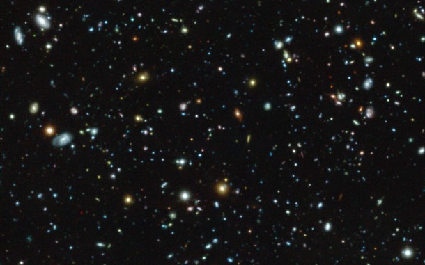 This colour image shows the Hubble Ultra Deep Field region, a tiny but much-studied region in the constellation of Fornax, as observed with the MUSE instrument on ESO’s Very Large Telescope. But this picture only gives a very partial view of the riches of the MUSE data, which also provide a spectrum for each pixel in the picture. Credit: ESO/MUSE HUDF collaboration This colour image shows the Hubble Ultra Deep Field region, a tiny but much-studied region in the constellation of Fornax, as observed with the MUSE instrument on ESO’s Very Large Telescope. But this picture only gives a very partial view of the riches of the MUSE data, which also provide a spectrum for each pixel in the picture. Credit: ESO/MUSE HUDF collaboration