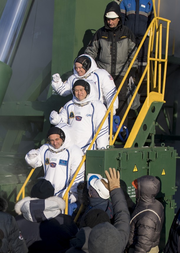 Expedition 54 flight engineer Scott Tingle of NASA, flight engineer Norishige Kanai of Japan Aerospace Exploration Agency, and Soyuz Commander Anton Shkaplerov of the Russian space agency Roscosmos wave farewell prior to boarding the Soyuz MS-07 for launch Sunday, Dec. 17, 2017 at the Baikonur Cosmodrome in Kazakhstan. Tingle, Norishige Kanai, and Shkaplerov will spend the next five months living and working aboard the International Space Station. Credits: NASA/Joel Kowsky Expedition 54 flight engineer Scott Tingle of NASA, flight engineer Norishige Kanai of Japan Aerospace Exploration Agency, and Soyuz Commander Anton Shkaplerov of the Russian space agency Roscosmos wave farewell prior to boarding the Soyuz MS-07 for launch Sunday, Dec. 17, 2017 at the Baikonur Cosmodrome in Kazakhstan. Tingle, Norishige Kanai, and Shkaplerov will spend the next five months living and working aboard the International Space Station. Credits: NASA/Joel Kowsky