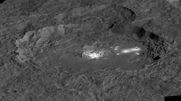 The bright areas of Occator Crater -- Cerealia Facula in the center and Vinalia Faculae to the side -- are examples of bright material found on crater floors on Ceres. This is a simulated perspective view. Image Credit: NASA/JPL-Caltech/UCLA/MPS/DLR/IDA/PSI The bright areas of Occator Crater -- Cerealia Facula in the center and Vinalia Faculae to the side -- are examples of bright material found on crater floors on Ceres. This is a simulated perspective view. Image Credit: NASA/JPL-Caltech/UCLA/MPS/DLR/IDA/PSI