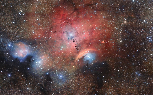 The OmegaCAM imager on ESO’s VLT Survey Telescope has captured this glittering view of the stellar nursery called Sharpless 29. Many astronomical phenomena can be seen in this giant image, including cosmic dust and gas clouds that reflect, absorb, and re-emit the light of hot young stars within the nebula. Credit: ESO/M. Kornmesser The OmegaCAM imager on ESO’s VLT Survey Telescope has captured this glittering view of the stellar nursery called Sharpless 29. Many astronomical phenomena can be seen in this giant image, including cosmic dust and gas clouds that reflect, absorb, and re-emit the light of hot young stars within the nebula. Credit: ESO/M. Kornmesser