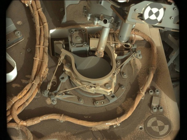The drill bit of NASA's Curiosity Mars rover over one of the sample inlets on the rover's deck. The inlets lead to Curiosity's onboard laboratories. This image was taken on Sol 2068 by the rover's Mast Camera (Mastcam).Credits: NASA/JPL-Caltech/MSSS The drill bit of NASA's Curiosity Mars rover over one of the sample inlets on the rover's deck. The inlets lead to Curiosity's onboard laboratories. This image was taken on Sol 2068 by the rover's Mast Camera (Mastcam).Credits: NASA/JPL-Caltech/MSSS