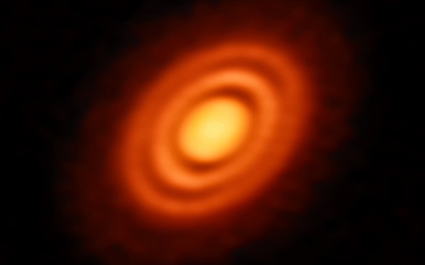 The three gaps between the rings are likely due to a depletion of dust and in the middle and outer gaps astronomers also found a lower level of gas. The depletion of both dust and gas suggests the presence of newly formed planets, each around the mass of Saturn, carving out these gaps on their brand new orbits. Credit: ESO, ALMA (ESO/NAOJ/NRAO); A. Isella; B. Saxton (NRAO/AUI/NSF) The three gaps between the rings are likely due to a depletion of dust and in the middle and outer gaps astronomers also found a lower level of gas. The depletion of both dust and gas suggests the presence of newly formed planets, each around the mass of Saturn, carving out these gaps on their brand new orbits. Credit: ESO, ALMA (ESO/NAOJ/NRAO); A. Isella; B. Saxton (NRAO/AUI/NSF)