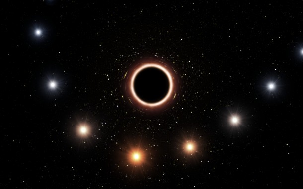 This artist’s impression shows the path of the star S2 as it passes very close to the supermassive black hole at the centre of the Milky Way. As it gets close to the black hole the very strong gravitational field causes the colour of the star to shift slightly to the red, an effect of Einstein’s general thery of relativity. In this graphic the colour effect and size of the objects have been exaggerated for clarity. Credit: ESO/M. Kornmesser This artist’s impression shows the path of the star S2 as it passes very close to the supermassive black hole at the centre of the Milky Way. As it gets close to the black hole the very strong gravitational field causes the colour of the star to shift slightly to the red, an effect of Einstein’s general thery of relativity. In this graphic the colour effect and size of the objects have been exaggerated for clarity. Credit: ESO/M. Kornmesser